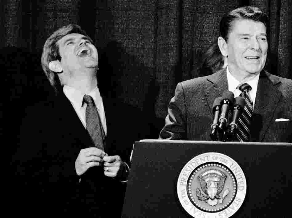 Then a congressman from Georgia, Newt Gingrich laughs at a joke told by President Reagan in Atlanta in 1984. 