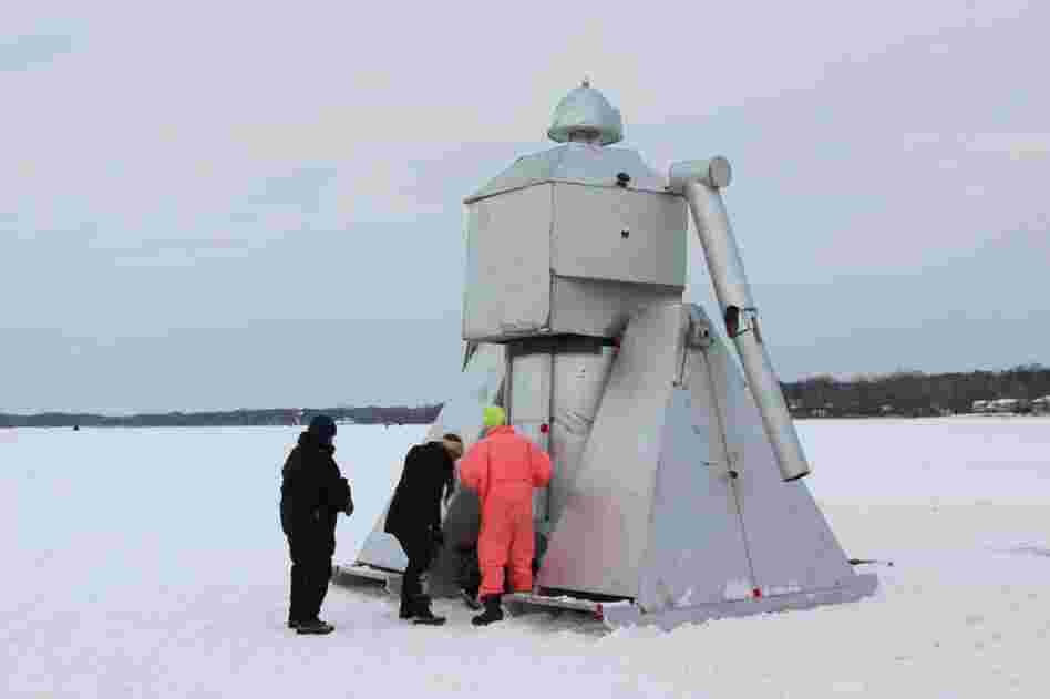 A periscope at the bottom of the Robot Reprise shanty gives visitors a robot's-eye-view of the frozen lake.