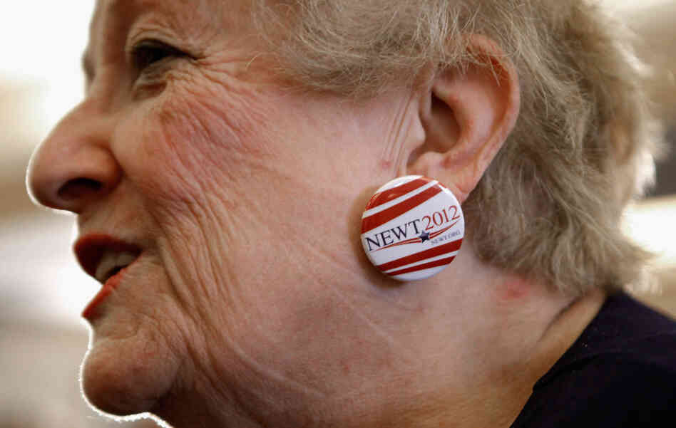 Judy Youngblood of Jacksonville, Fla., appears at a rally at the Hyatt Regency Jacksonville Riverfront hotel Monday, wearing earrings she made from campaign buttons supporting Newt Gingrich. Judy Youngblood of Jacksonville, Fla., appears at a rally at the Hyatt Regency Jacksonville Riverfront hotel Monday, wearing earrings she made from campaign buttons supporting Newt Gingrich.