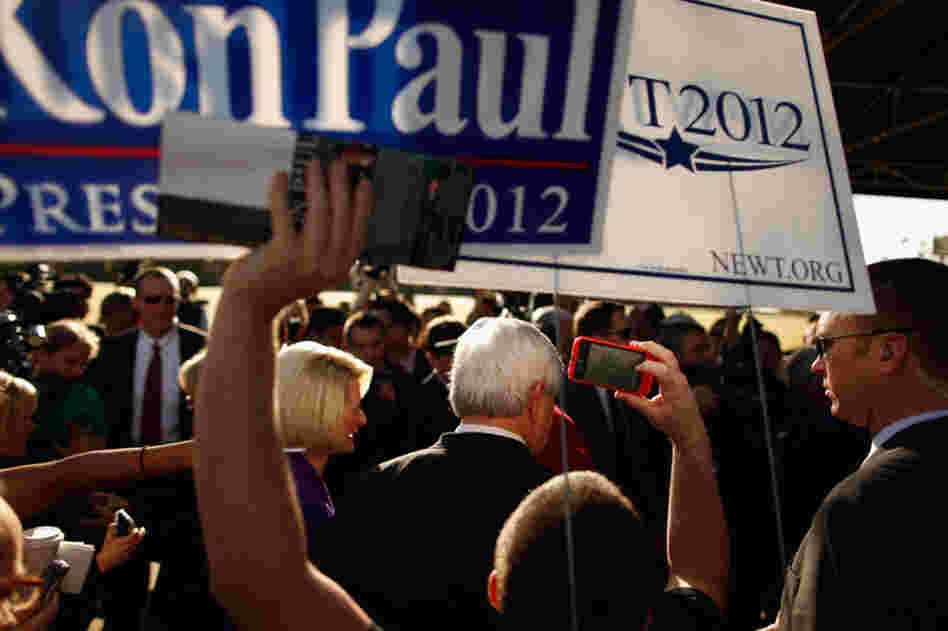 Gingrich and his wife, Callista, campaign outside a polling place in Windermere. 