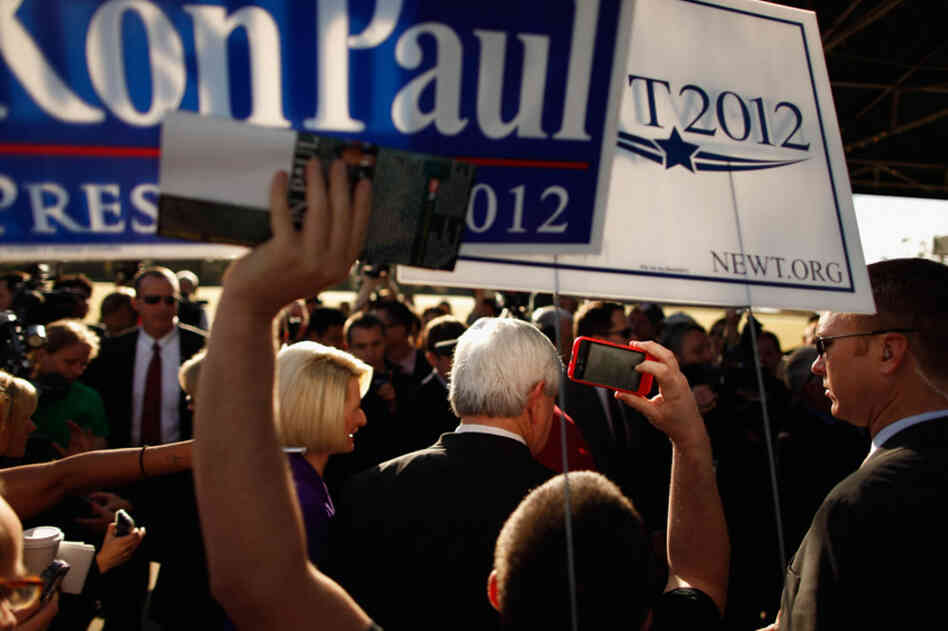 Gingrich and his wife, Callista, campaign outside a polling place in Windermere. 