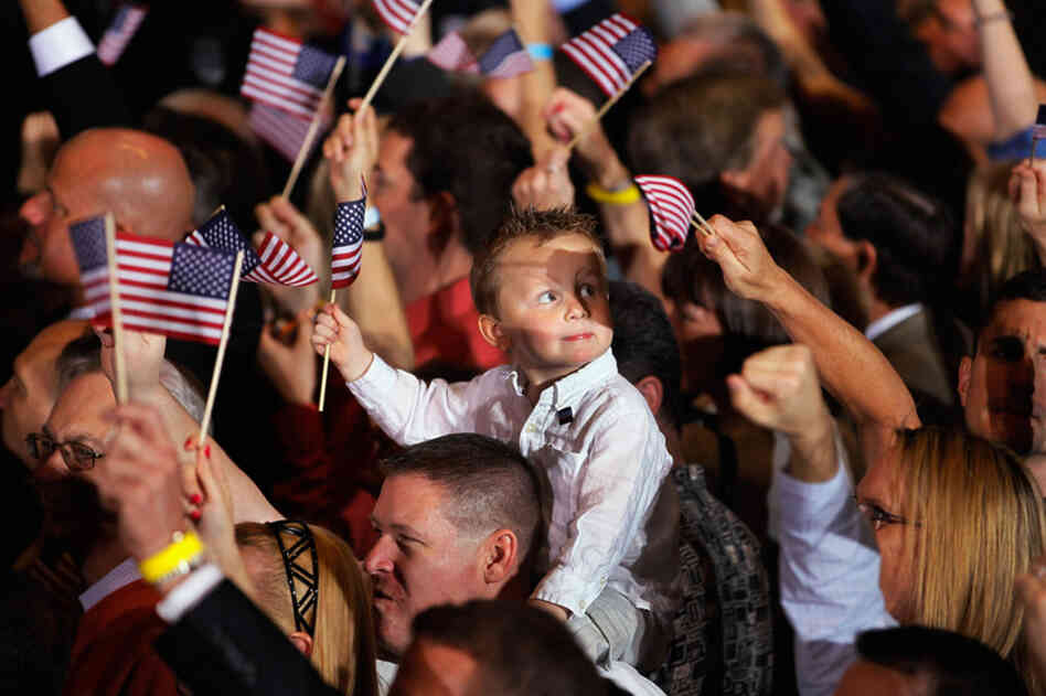 Romney's supporters eagerly await his speech during a rally on primary night in Tampa. His convincing win has re-established him as the GOP front-runner. 