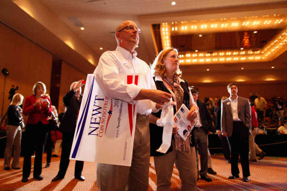 Gingrich supporters in Orlando listen as Mitt Romney is declared the winner of the Florida primary. 