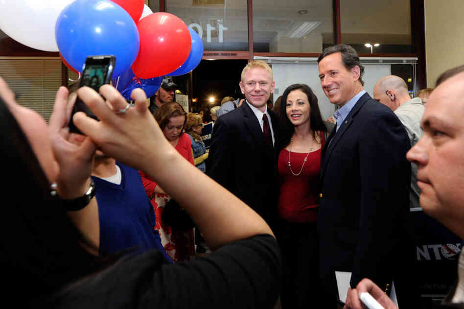 Rick Santorum poses for photos with supporters at an election results party for the Florida primary at his Nevada campaign headquarters in Las Vegas. His basic message last night was that "Republicans can do better." 