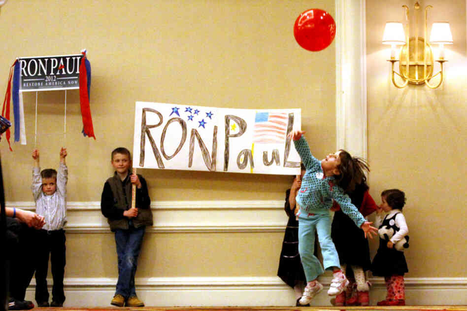 Young Ron Paul supporters wait for Paul to arrive for a town hall meeting in Denver. 