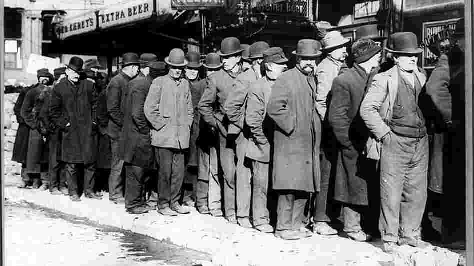 A bread line forms outside of the Rescue Society in New York City in 1929. "Brother, Can You Spare a Dime?" directly confronted the hardship of the Great Depression.
