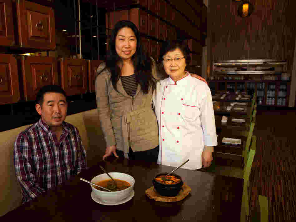 Danny Lee, Jean Lee and their mother, Yesoon Lee, cook home-style Korean soups at their Mandu restaurants in Washington, D.C.