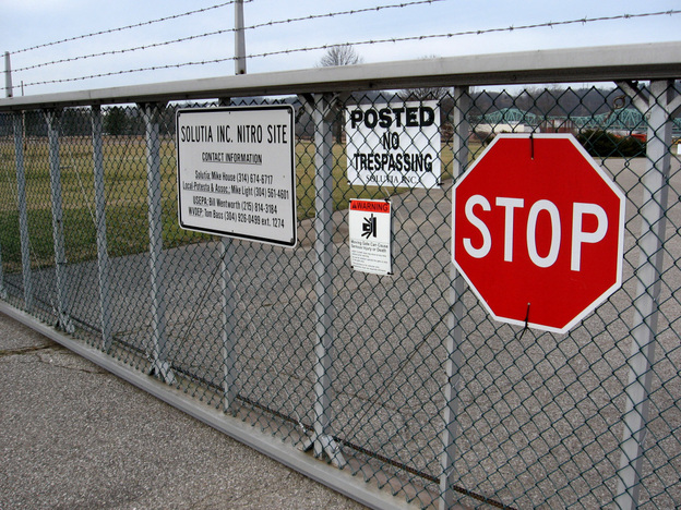A gate into the former Monsanto chemical plant near Nitro, W.Va. A class-action lawsuit filed against Monsanto (and subsequent company Solutia) claims the company improperly polluted the town with dioxin.