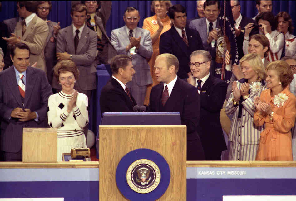 Then-Gov. Ronald Reagan was severely critical of incumbent President Ford when he challenged him for the Republican nomination.  Ford, right center, thanks Reagan, left center, for his remarks on the closing night of the Republican National Convention, Aug. 19, 1976. 