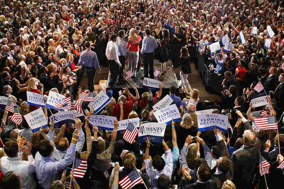 Romney hugs his wife, Ann, while surrounded by their family and elated supporters at a primary night rally in Tampa. 