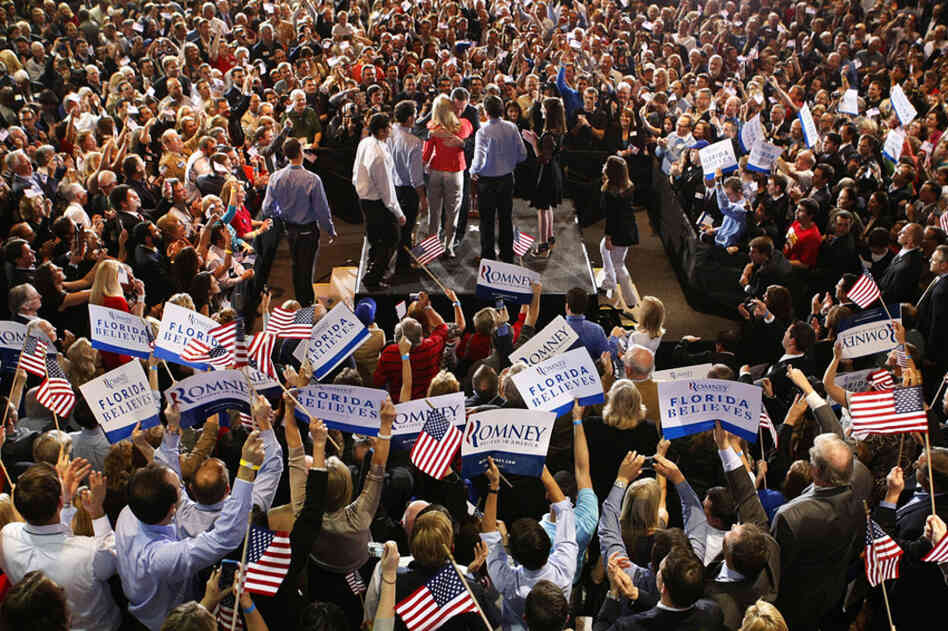Romney hugs his wife, Ann, while surrounded by their family and elated supporters at a primary night rally in Tampa. 