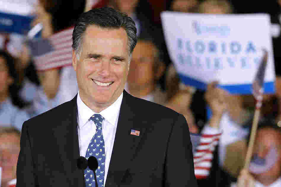 Mitt Romney smiles at supporters at his primary victory rally in Tampa on Tuesday. "While we celebrate this victory, we must not forget what this election is really about: defeating Barack Obama," the Romney campaign said via Twitter. 