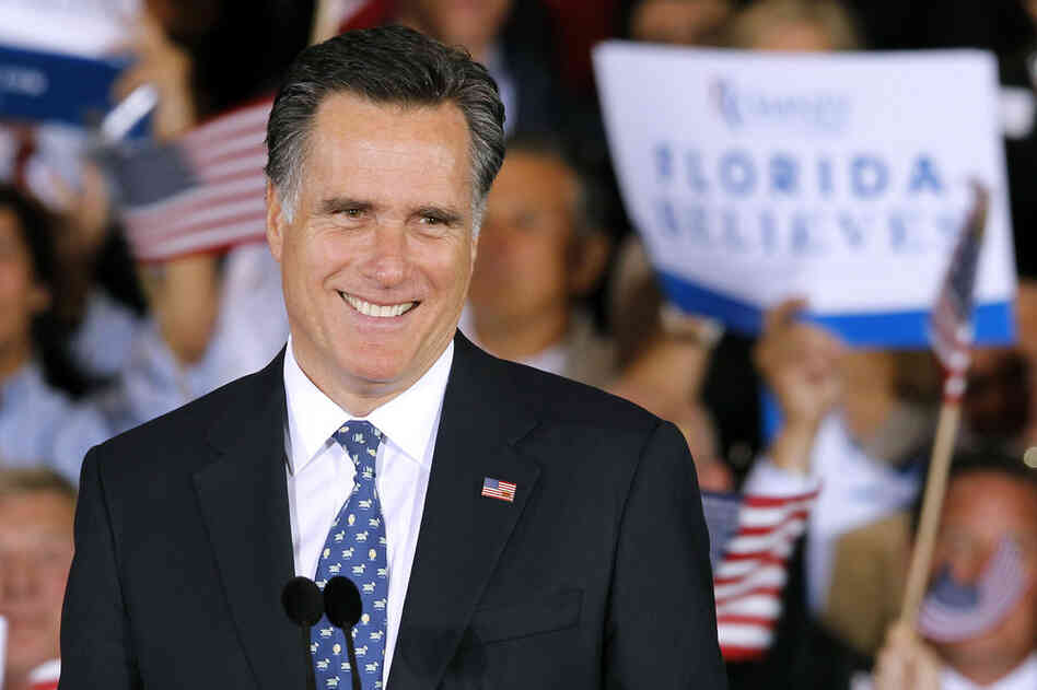 Mitt Romney smiles at supporters at his primary victory rally in Tampa on Tuesday. "While we celebrate this victory, we must not forget what this election is really about: defeating Barack Obama," the Romney campaign said via Twitter. 
