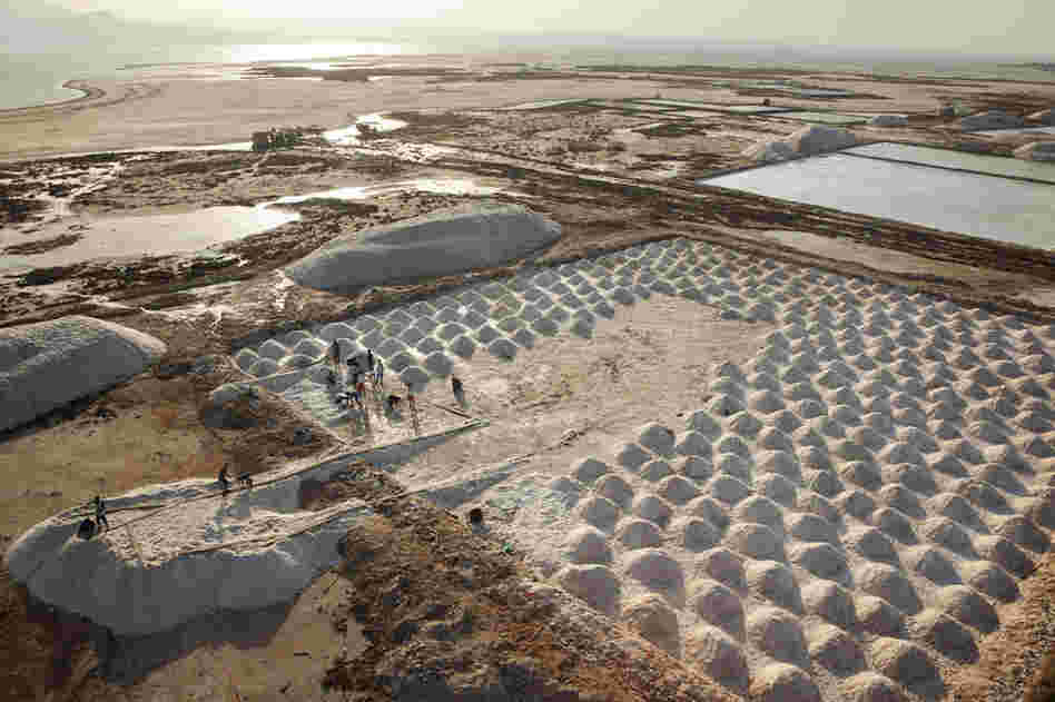 Workers at Lake Afrera process raw salt. Production was temporarily halted last year when a volcano in neighboring Eritrea erupted, blanketing the salt in ash.