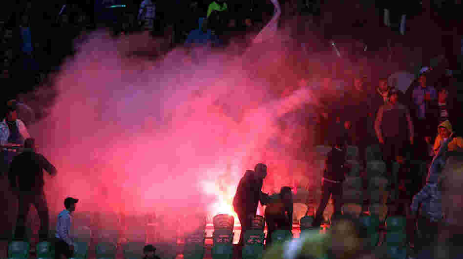 Flares were thrown in the stadium during clashes that erupted after a football match between Egypt's Al-Ahly and Al-Masry teams in Port Said.