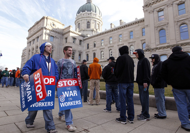 Union members protesting the right-to-work legislation wait to enter the Statehouse in Indianapolis on Wednesday.