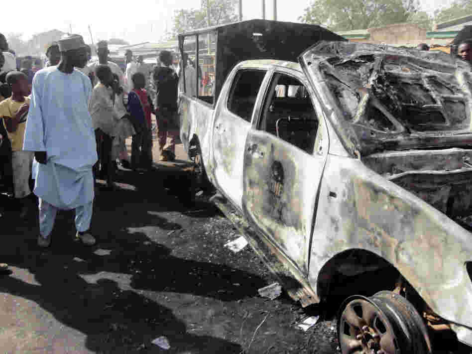A resident inspects a police van outside Sheka police station in the northern Nigerian city of Kano last month. Members of the Boko Haram Islamist group attacked the station the previous night. The group recently released a video calling for jihadis to focus on the United States.