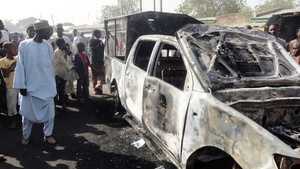 A resident inspects a police van outside Sheka police station in the northern Nigerian city of Kano last month. Members of the Boko Haram Islamist group attacked the station the previous night. The group recently released a video calling for jihadis to focus on the United States.