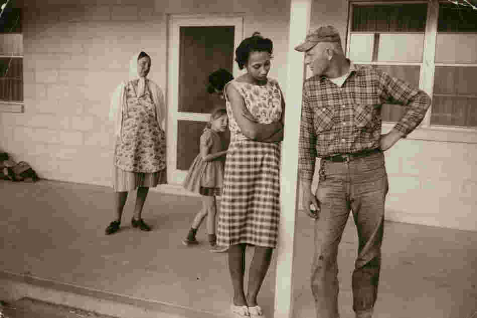 Mildred and Richard Loving; their daughter, Peggy; Mildred's sister Garnet; and Richard's mother, Lola, on the front porch of Mildred's mother's house, Caroline County, Va., April 1965. Mildred and Richard Loving; their daughter, Peggy; Mildred's sister Garnet; and Richard's mother, Lola, on the front porch of Mildred's mother's house, Caroline County, Va., April 1965.