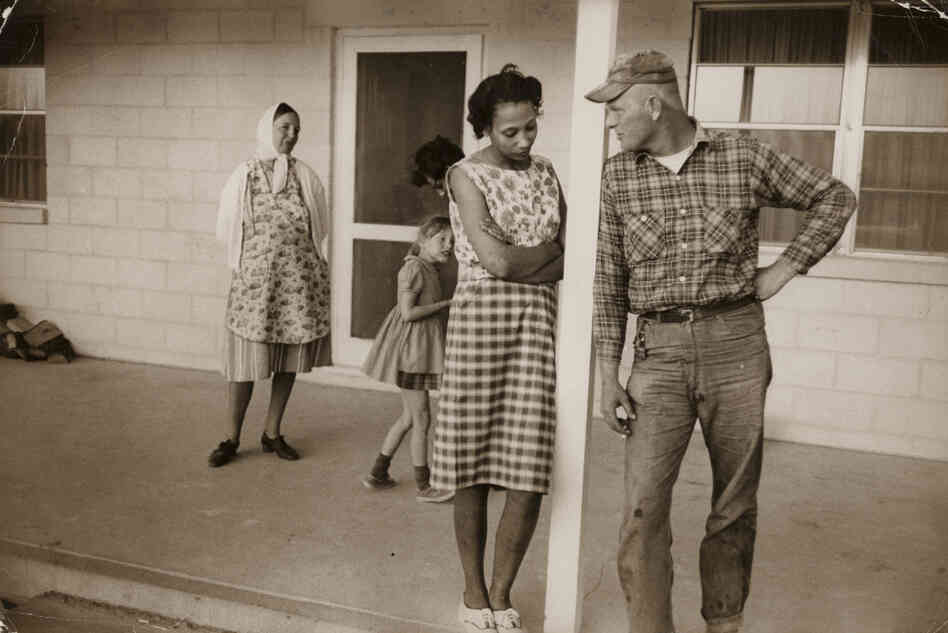 Mildred and Richard Loving; their daughter, Peggy; Mildred's sister Garnet; and Richard's mother, Lola, on the front porch of Mildred's mother's house, Caroline County, Va., April 1965. Mildred and Richard Loving; their daughter, Peggy; Mildred's sister Garnet; and Richard's mother, Lola, on the front porch of Mildred's mother's house, Caroline County, Va., April 1965.
