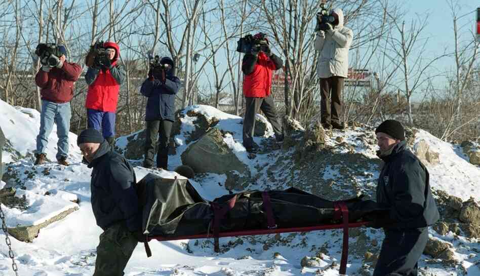 The body of informant John McIntyre being recovered in 2000. Whitey Bulger is alleged to have killed McIntyre in 1984 after being tipped off that McIntyre was informing on him. The body of informant John McIntyre being recovered in 2000. Whitey Bulger is alleged to have killed McIntyre in 1984 after being tipped off that McIntyre was informing on him.