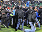 Fans rushed on to the field Wednesday after the soccer match in Port Said, Egypt. 
