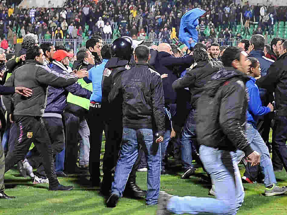 Fans rushed on to the field Wednesday after the soccer match in Port Said, Egypt. 
