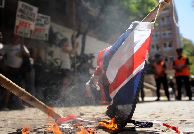 Argentine activists burn a Union Jack during a January protest in front of the British Embassy in Buenos Aires.