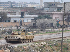 A Syrian army tank moving along a road during clashes with the Syrian army defectors, in the Rastan area in Homs province, central Syria, on Jan. 30. A Syrian army tank moving along a road during clashes with the Syrian army defectors, in the Rastan area in Homs province, central Syria, on Jan. 30.