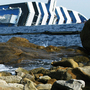 The Costa Concordia cruise ship remains half-submerged three weeks after it crashed. It continues to be a source of anger for local residents. The Costa Concordia cruise ship remains half-submerged three weeks after it crashed. It continues to be a source of anger for local residents.