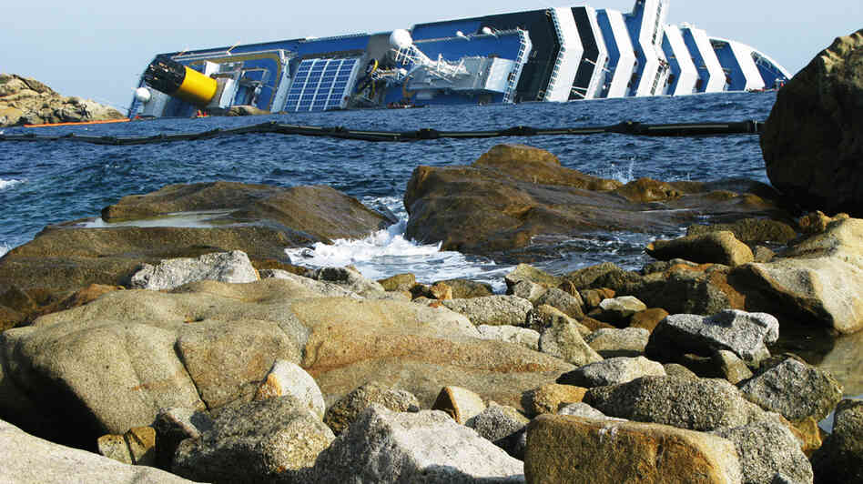 The Costa Concordia cruise ship remains half-submerged three weeks after it crashed. It continues to be a source of anger for local residents. The Costa Concordia cruise ship remains half-submerged three weeks after it crashed. It continues to be a source of anger for local residents.