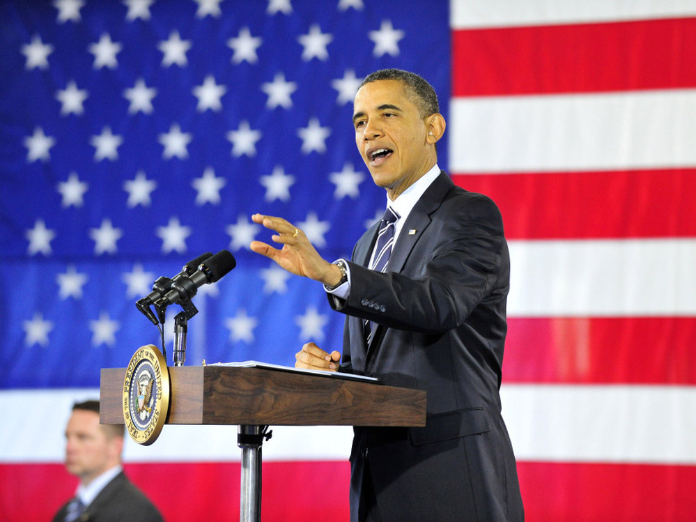 President Obama speaks about the economy Friday in Arlington, Va. Obama says he wants to "send a clear message to Congress: Do not slow down the recovery that we're on."