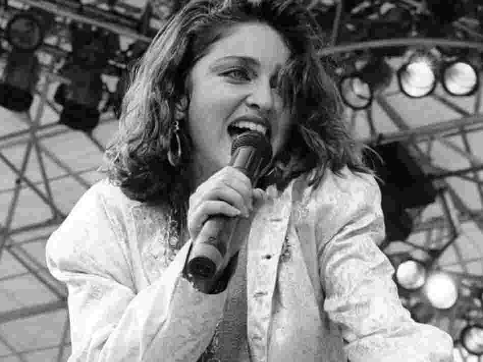 Madonna performs for a sold out crowd at the Live Aid concert at JFK Stadium in Philadelphia, Pennsylvania, July 13, 1985. Madonna performs for a sold out crowd at the Live Aid concert at JFK Stadium in Philadelphia, Pennsylvania, July 13, 1985.