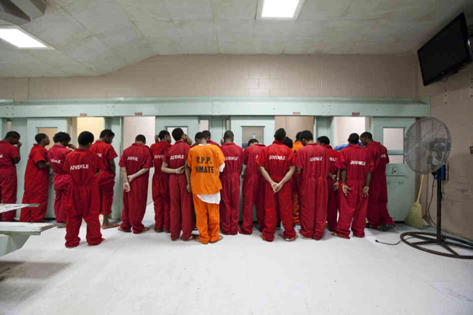 The Orleans Parish Prison in Louisiana is an adult facility with a wing for juveniles. On this day, the air conditioning is not working. There was a fight the night before, so the inmates lost privileges for TV, cards and dominoes. 
