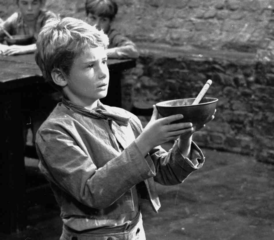 Poor orphan Oliver Twist was one of the 989 named characters Dickens created during his prolific career. Above, Mark Lester asks for more gruel during the 1967 filming of Oliver!