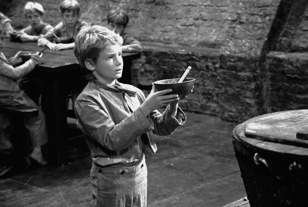 Poor orphan Oliver Twist was one of the 989 named characters Dickens created during his prolific career. Above, Mark Lester asks for more gruel during the 1967 filming of Oliver!