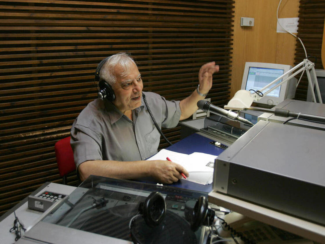 Iranian-born Menashe Amir (shown here in 2006) hosts a call-in show on Israel Radio's Farsi service, one of the few forums for direct discourse between Iranians and Israelis. 