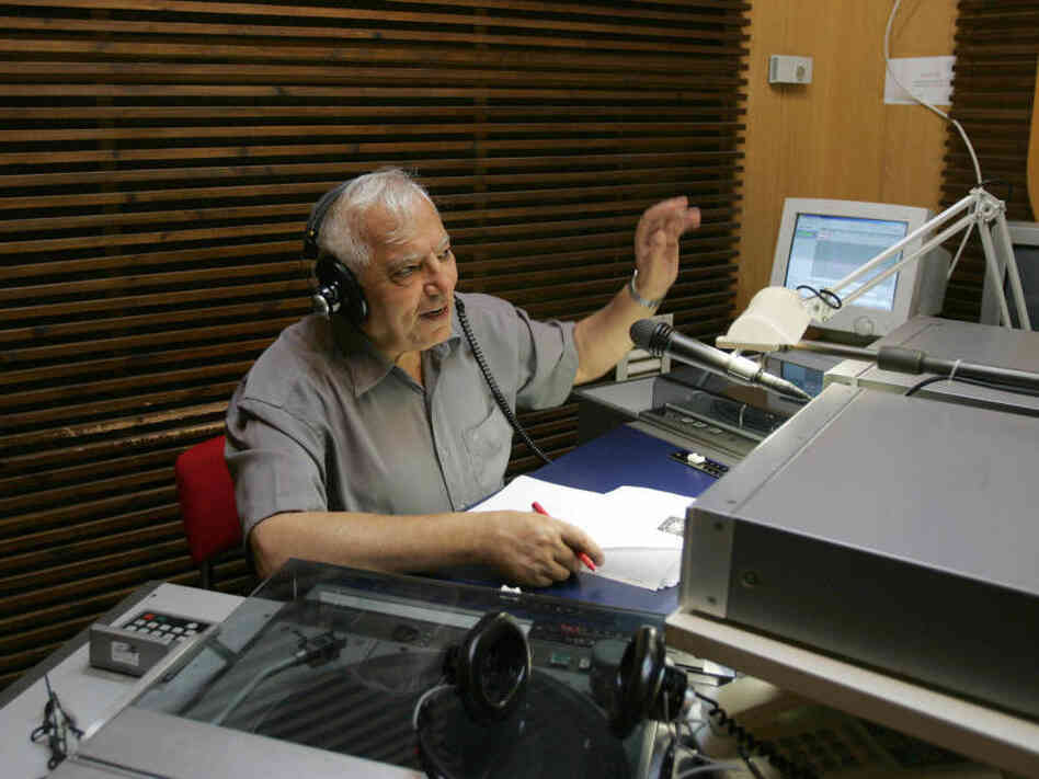Iranian-born Menashe Amir (shown here in 2006) hosts a call-in show on Israel Radio's Farsi service, one of the few forums for direct discourse between Iranians and Israelis. 