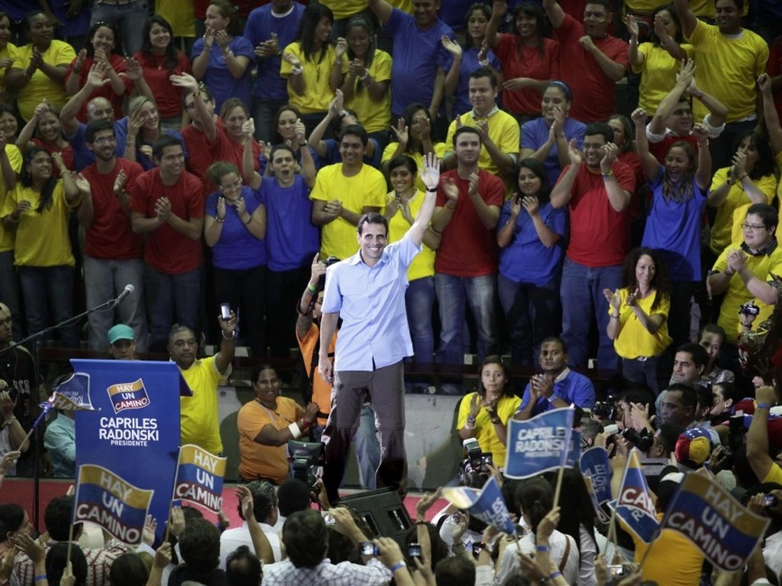 Venezuelan opposition leader Henrique Capriles (center) waves to supporters on Oct. 12, 2011. Capriles is the front-runner in the opposition primary election to pick a candidate to run against President Hugo Chavez. The primary is scheduled for Feb. 12.