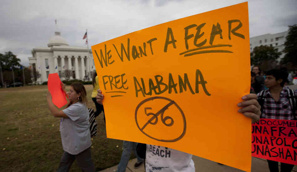 Protesters march outside Alabama's Capitol in Montgomery on Nov. 15 during a demonstration against the state's immigration law. Protesters march outside Alabama's Capitol in Montgomery on Nov. 15 during a demonstration against the state's immigration law.