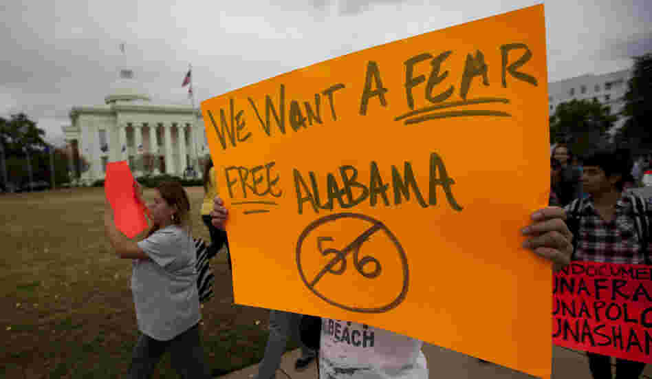 Protesters march outside Alabama's Capitol in Montgomery on Nov. 15 during a demonstration against the state's immigration law. Protesters march outside Alabama's Capitol in Montgomery on Nov. 15 during a demonstration against the state's immigration law.