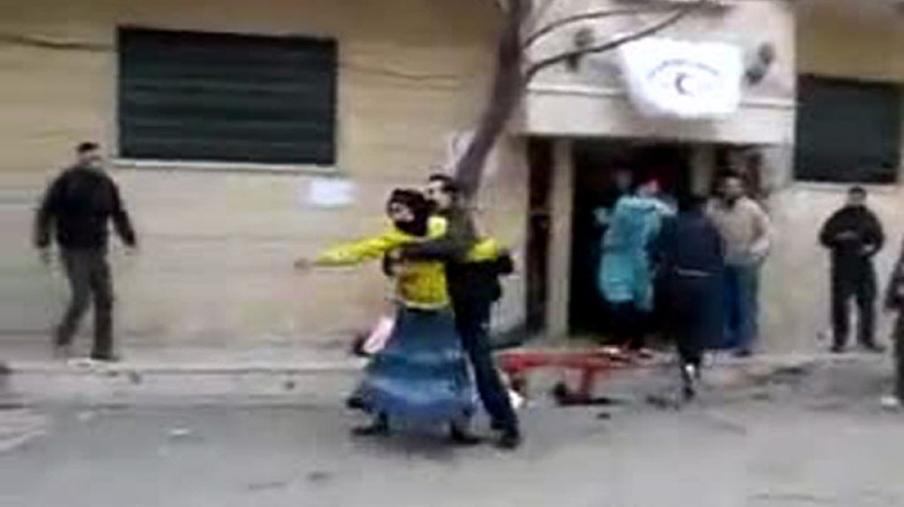 Activists say this image, taken from a video uploaded to YouTube, shows Syrians outside a field hospital in Homs earlier today. Blood stains the sidewalk. Because few foreign journalists are inside Syria, images such as this cannot be independently verified. 