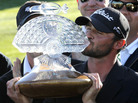 Tournament winner Kyle Stanley kisses the championship trophy after the final round of the Phoenix Open golf tournament on Sunday. Tournament winner Kyle Stanley kisses the championship trophy after the final round of the Phoenix Open golf tournament on Sunday.