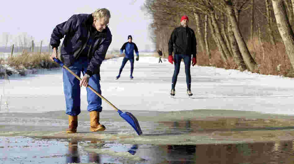 Volunteer Sjoerd Swart shovels away snow from the ice in Oudemirdum, Netherlands, in hopes the Elfstedentocht, or 11 Cities Tour, may be held for the first time in 15 years. 