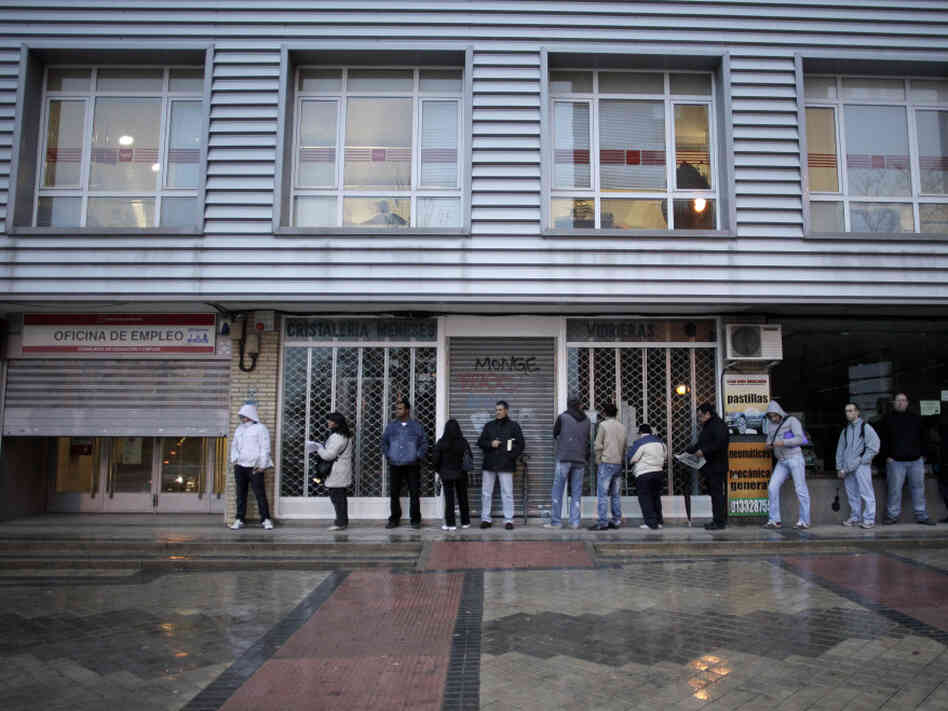 People queue outside an unemployment registry office in Madrid on Dec. 2. One in four Spaniards is out of work; about half of Spaniards in their 20s are jobless.