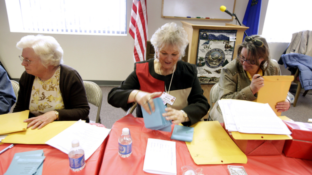 Caucuses have been plagued by embarrassing problems this election season, but they're an American tradition. Jan White, left, Brenda Robertson, center, and Janet Freixas, right, count paper ballots in Minden, Nev.