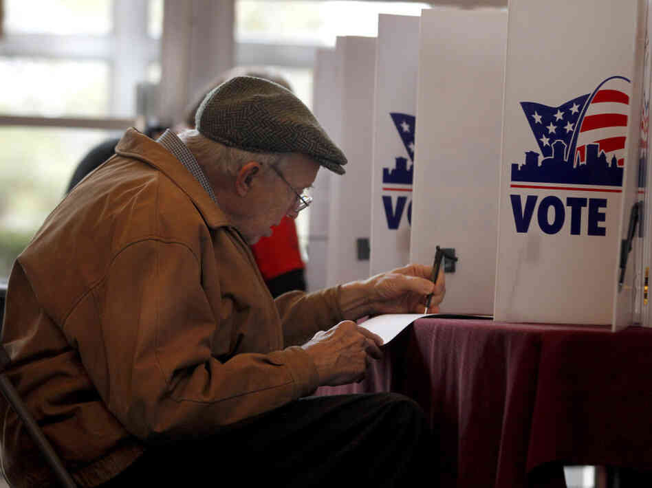 Charles Manley votes in Missouri's presidential primary on Tuesday in St. Louis.