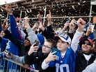 As the paper falls, New York Giants fans cheer during today's parade in Manhattan. As the paper falls, New York Giants fans cheer during today's parade in Manhattan.