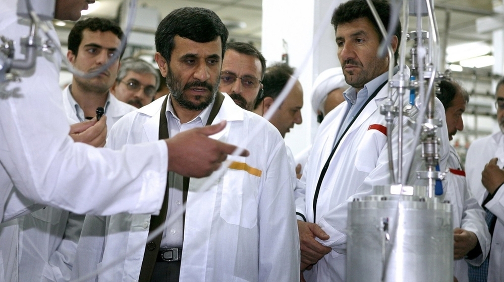 Despite international pressure, Iran has pressed ahead with its nuclear program. Here, Iranian President Mahmoud Ahmadinejad listens to a technician during a visit to the Natanz Uranium Enrichment Facility, 200 miles south of the capital, Tehran, in 2008.