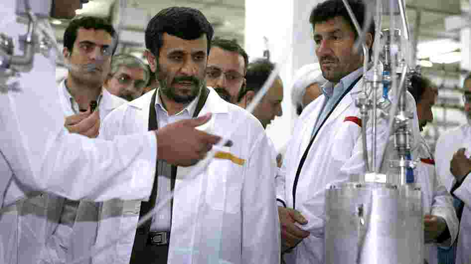 Despite international pressure, Iran has pressed ahead with its nuclear program. Here, Iranian President Mahmoud Ahmadinejad listens to a technician during a visit to the Natanz Uranium Enrichment Facility, 200 miles south of the capital, Tehran, in 2008.